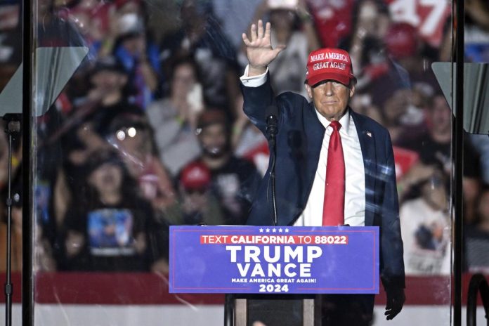 Man arrested near Trump rally in California charged with gun offenses.